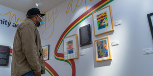 Person looking at artwork on a wall