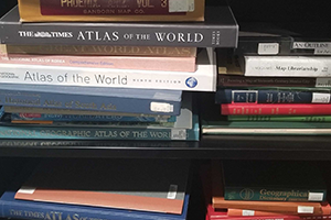 A stack of books on a shelf.